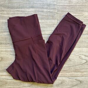 Athleta Salutation Stash 7/8 Leggings size small color Spiced Cabernet